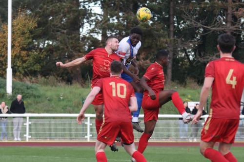 IMG 6953-Enfields-Jerry-Gyebi-white-shirt-wins-a-header