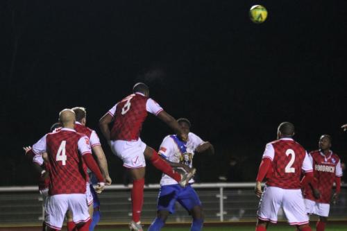 IMG 5935-Wingates-Daniel-Pappoe-heads-clear-from-Jerry-Gyebis