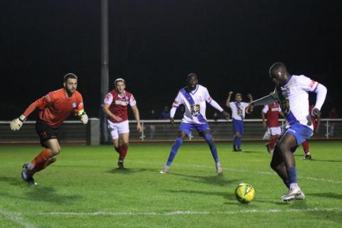 IMG 5993-Percy-Kiangebeni-collects-the-rebound-from-Lyle-Della-Verdes-shot-against-the-bar-as-keeper-Ben-Goode-rushes-out-to-block