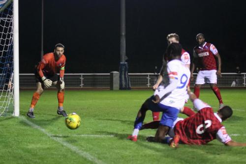 IMG 6013-Wingates-Tommy-Tejan-Sie-red-slides-in-to-stop-Andre-Coker-crossing