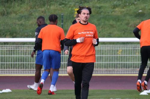 IMG 6062-Enfields-Sam-Youngs-wearing-a-warm-up-top-in-support-of-National-hate-crime-awareness-week