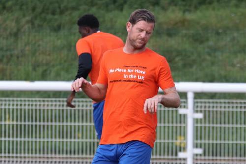 IMG 6064-Enfields-Adam-Cunnington-wearing-a-warm-up-top-in-support-of-National-hate-crime-awareness-week