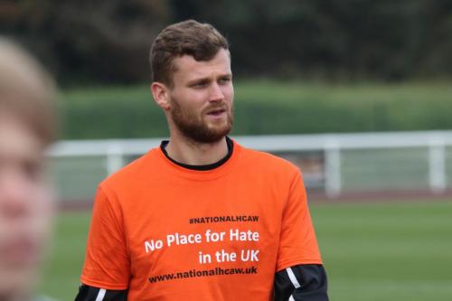 IMG 6070-Enfields-Rian-Bray-wearing-a-warm-up-top-in-support-of-National-hate-crime-awareness-week