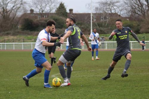 IMG 3200-Enfields-Lyle-Della-Verde-runs-at-Callum-Robinson-as-Tom-Barton-covers