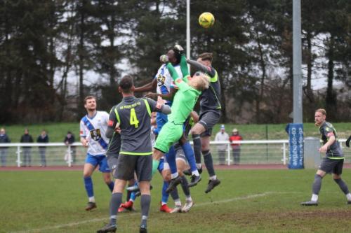 IMG 3230-East-Thurrock-keeper-Arthur-Janata-misses-his-punch-but-is-judged-to-have-been-fouled-by-Jerry-Gyebi