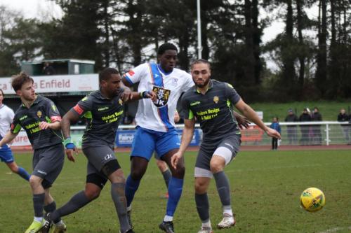 IMG 3343-Enfields-Jerry-Gyebi-is-outnumbered-by-Ben-Wyss-L-Curtis-Ujah-and-Callum-Robinson-R