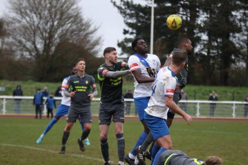 IMG 3438-Enfields-Jerry-Gyebi-challenges-Curtis-Ujah-at-a-long-throw-but-Adam-Cunnington-is-penalised-for-a-foul-on-Ryan-Boswell