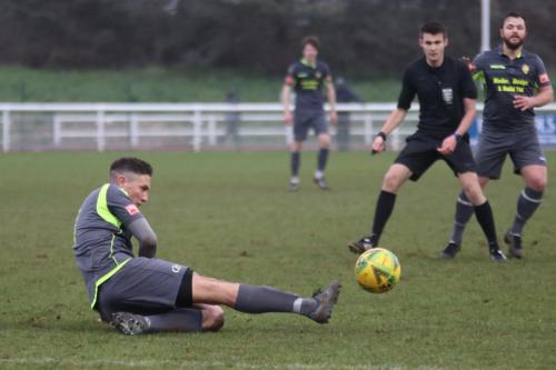 IMG 3562-Tom-Barton-loses-his-footing-but-still-manages-to-clear-the-ball