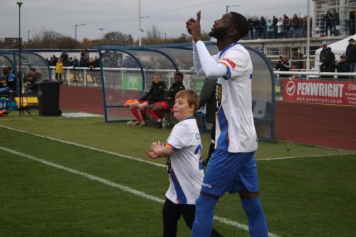 IMG 7721-Muhammadu-Faal-with-one-of-the-Enfield-mascots-for-the-day