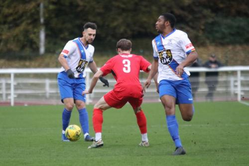 IMG 7743-Enfields-Lyle-Della-Verde-L-plays-the-ball-past-Jude-Mason-to-Jon-Muleba