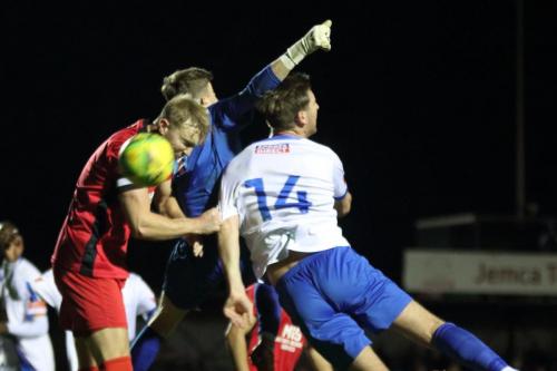 IMG 8040-Mersthams-James-Richmond-L-and-Toby-Bull-and-Enfields-Adam-Cunnington-challenge-for-the-ball