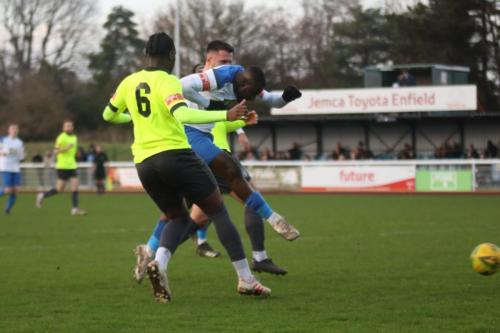 IMG 9013-Enfields-Percy-Kiangebeni-shoots-under-pressure-from-Kieron-Cathkine-6-and-Luke-Tingey