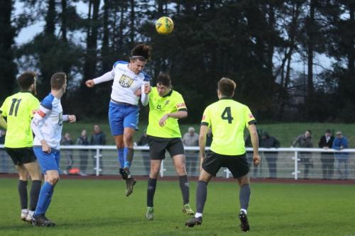 IMG 9090-Enfields-Sam-Youngs-wins-a-header-against-Max-Delyfer