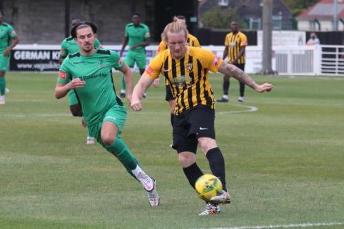 Folkestone's Finn O'Mara clears from Sam Youngs