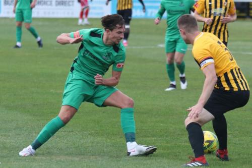 Enfield's Sam Youngs (L) and Folkestone's Callum Davies