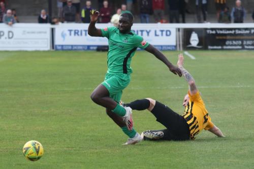 Enfield's Percy Kiangebeni evades a tackle from Finn O'Mara