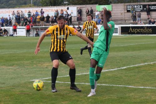 Folkestone's Josh Vincent (L) and Enfield's Muhammadu Faal