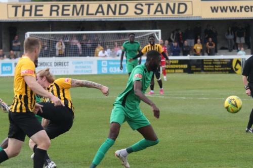 Enfield's Muhammadu Faal and Folkestone's Alfie Paxman (L) and Finn O'Mara