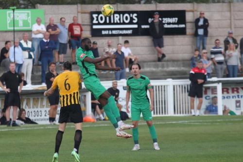 Enfield's Muhammadu Faal and Sam Youngs (R) and Folkestone's Ryan Johnson
