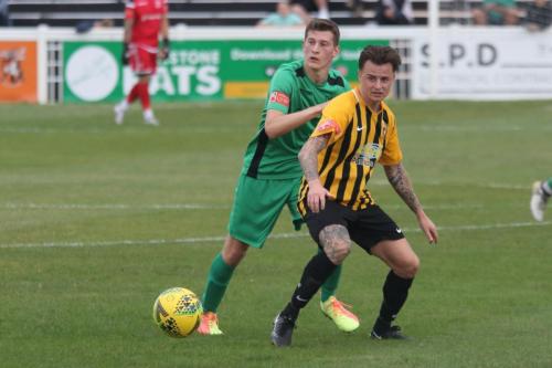 IEnfield's Ryan Kirwan (L) and Folkestone's Jordan Wright