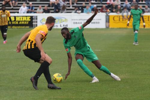 Enfield's Muhammadu Faal (R) and Folkestone's Josh Vincent