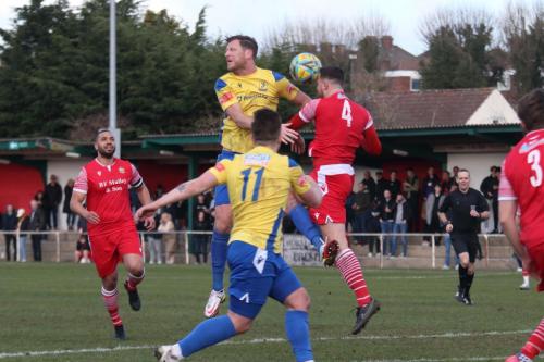 IMG 3901-Jordan-Clark-heads-clear-from-Adam-Cunnington