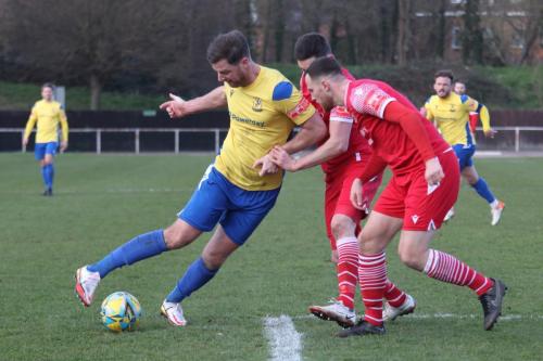 IMG 3946-Adam-Cunnington-L-tries-to-get-between-Jordan-Clark-and-Tom-Wraight