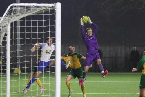 IMG 0313-Horshams-Sam-Howes-catches-a-cross-as-Adam-Cunnington-lurks-at-the-far-post-hoping-for-an-error