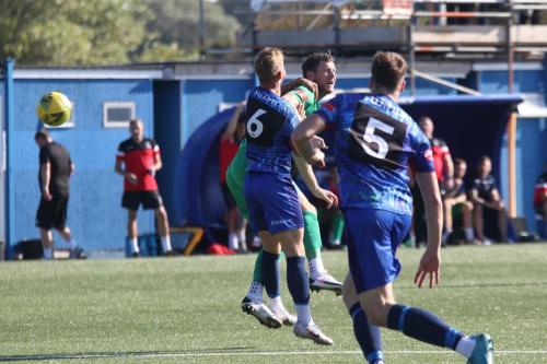 IMG 4753-Enfields-Adam-Cunnington-wins-a-header-against-Ben-Swift-6