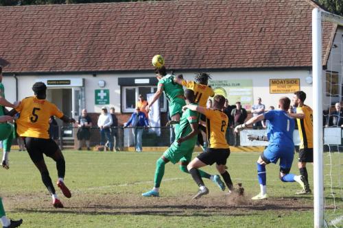 IMG 4970-Enfields-Sam-Youngs-wins-a-header-against-Tahjae-Anderson