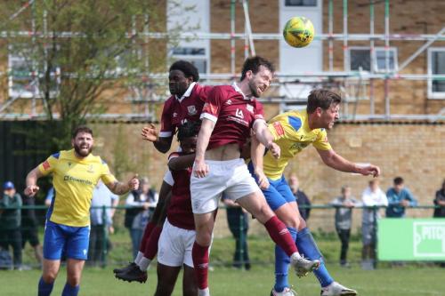 IMG 6316-Potters-Bars-Calvin-Dickson-heads-clear-from-Adam-Cunnington