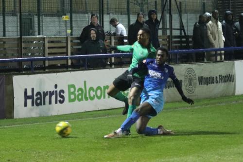 IMG 2856-Wingates-Theo-Ofori-tackles-Jon-Muleba
