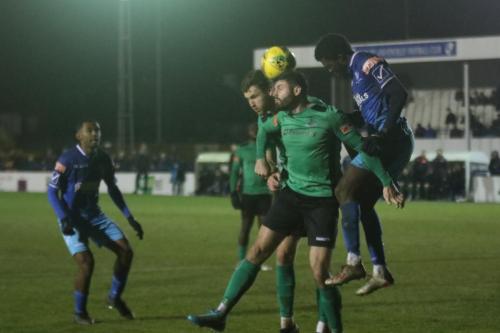 IMG 2957-Wingates-Daniel-Emovon-heads-clear-from-Rian-Bray-and-Jake-Cass