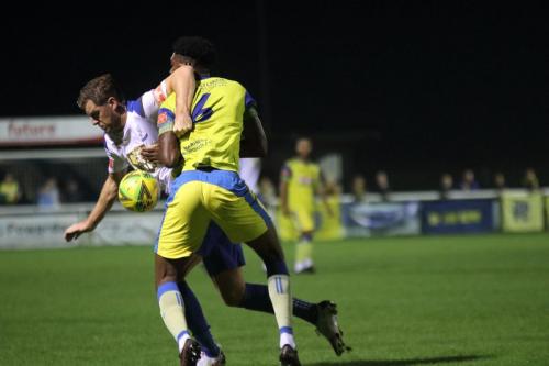 IMG 4313-Haringeys-Tyrese-Owen-yellow-and-Enfields-Adam-Cunnington-tussle-for-possession