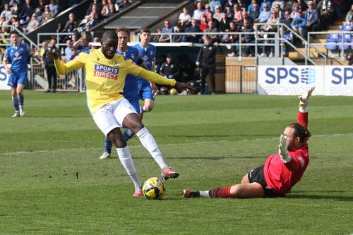 IMG 9136-Michael-Bakare-takes-the-ball-round-Jack-Giddens-before-scoring