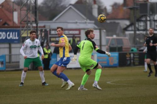 IMG 5951-Bognor-keeper-Matt-Rowley-clears-from-Adam-Cunnington