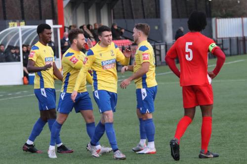 IMG 3020-Enfield-players-congratulate-Marcus-Wyllie-centre-whose-cross-set-up-the-third-goal