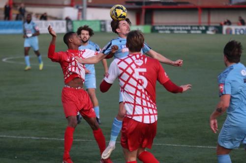 IMG 0996-Enfields-Sam-Youngs-wins-a-header-against-Gus-Sow