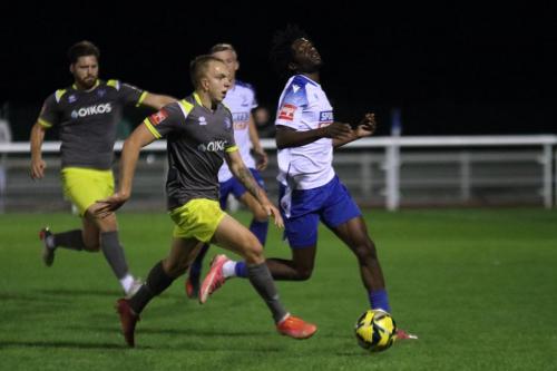 IMG 7850-Canveys-Reiss-Chandler-reaches-the-ball-ahead-of-Andre-Coker