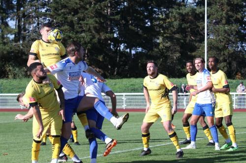 IMG 8940Cheshams-Matthew-Ridley-wins-a-header-against-Adma-Cunnington