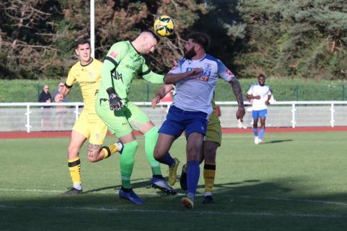 IMG 9092-Chesham-keeper-Sam-Beasant-heads-clear-from-Jake-Cass