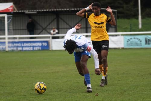 IMG 7542-Enfields-Andre-Coker-has-his-heels-clipped-by-Nyren-Clunis