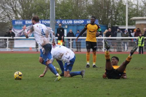 IMG 7635-James-Dayton-4-comes-away-with-the-ball-after-a-challenge-between-Joe-Payne-and-Nyren-Clunis