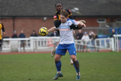 IMG 8048-Lewis-Taaffe-shields-the-ball-from-Harrison-Sodje