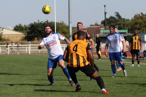 IMG 6711-Jake-Cass-L-nods-the-ball-past-Ian-Gayle-4