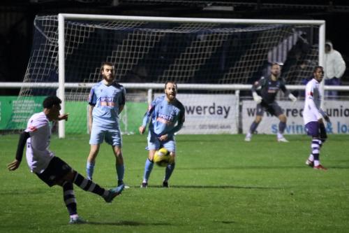 IMG 8757-Casuals-Ruben-Carvalho-curls-a-free-kick-past-Bilal-Sayoud-centre-and-James-Dayton