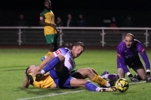 IMG 8310-Enfields-Adam-Cunnington-is-tackled-from-behind-by-Luca-Cocoracchio-but-manages-to-scramble-the-ball-home