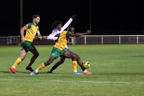 IMG 8384-Horshams-Chris-Sessegnon-challenges-Andre-Coker-watched-by-Jack-Brivio