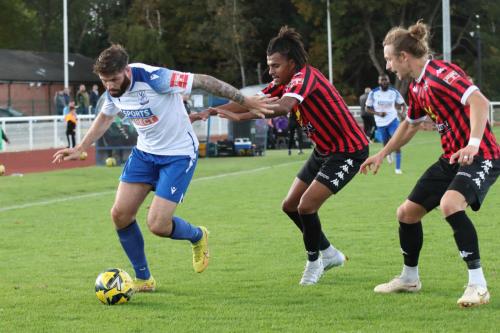 IMG 9523-Jake-Cass-tries-to-get-past-Jamie-Mascoll-and-Will-Salmon-R