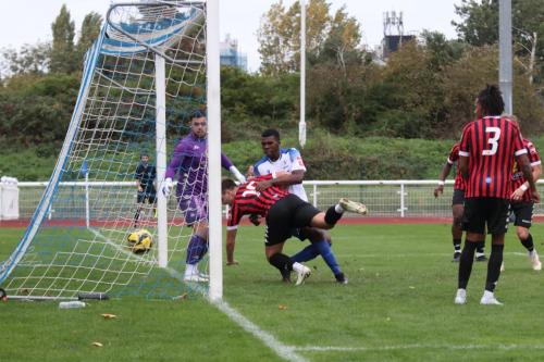 IMG 9621-James-Richmond-scores-the-second-Enfield-goal-whie-Alfie-Young-and-Dequane-Wilson-Braithwaite-wrestle-in-the-goalmouth